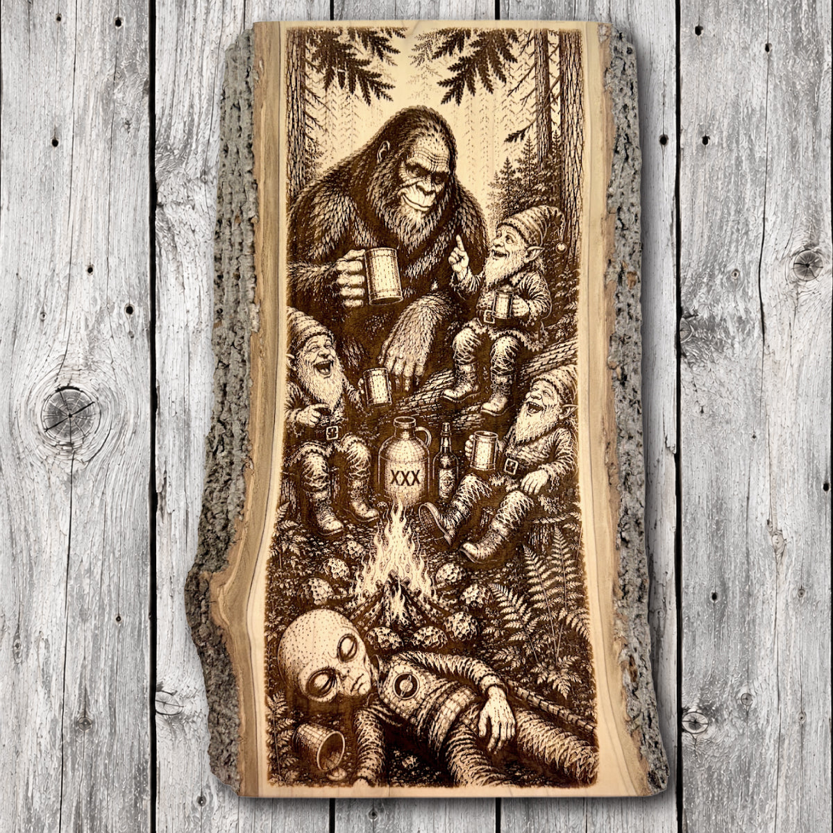 Humorous Bigfoot and three woodland gnomes sharing drinks around a forest campfire with a sleeping alien in the foreground, laser engraved on natural live edge hardwood with bark edges.