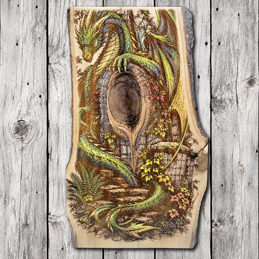 Hand-painted and laser engraved live edge wood wall art featuring a green dragon wrapped around an ancient tree with a mysterious wooden doorway, stone steps, and colorful woodland flowers.