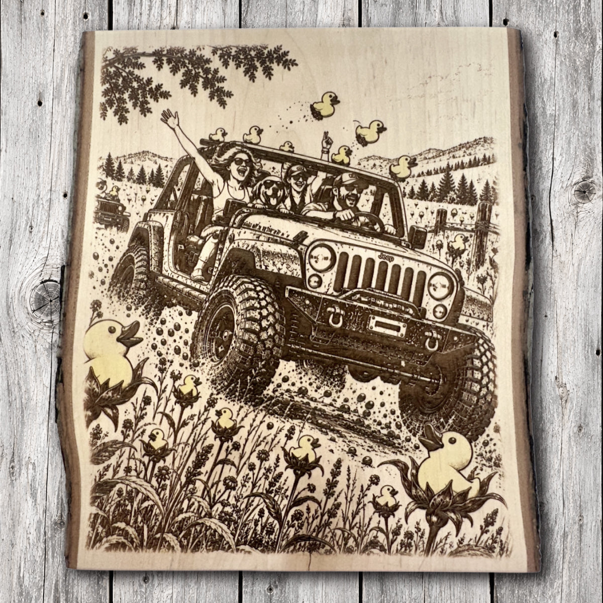 Live edge hardwood wall art featuring a Jeep with oversized off-road tires carrying excited passengers and a dog along a rocky mountain trail, surrounded by playful rubber ducks and wildflowers.