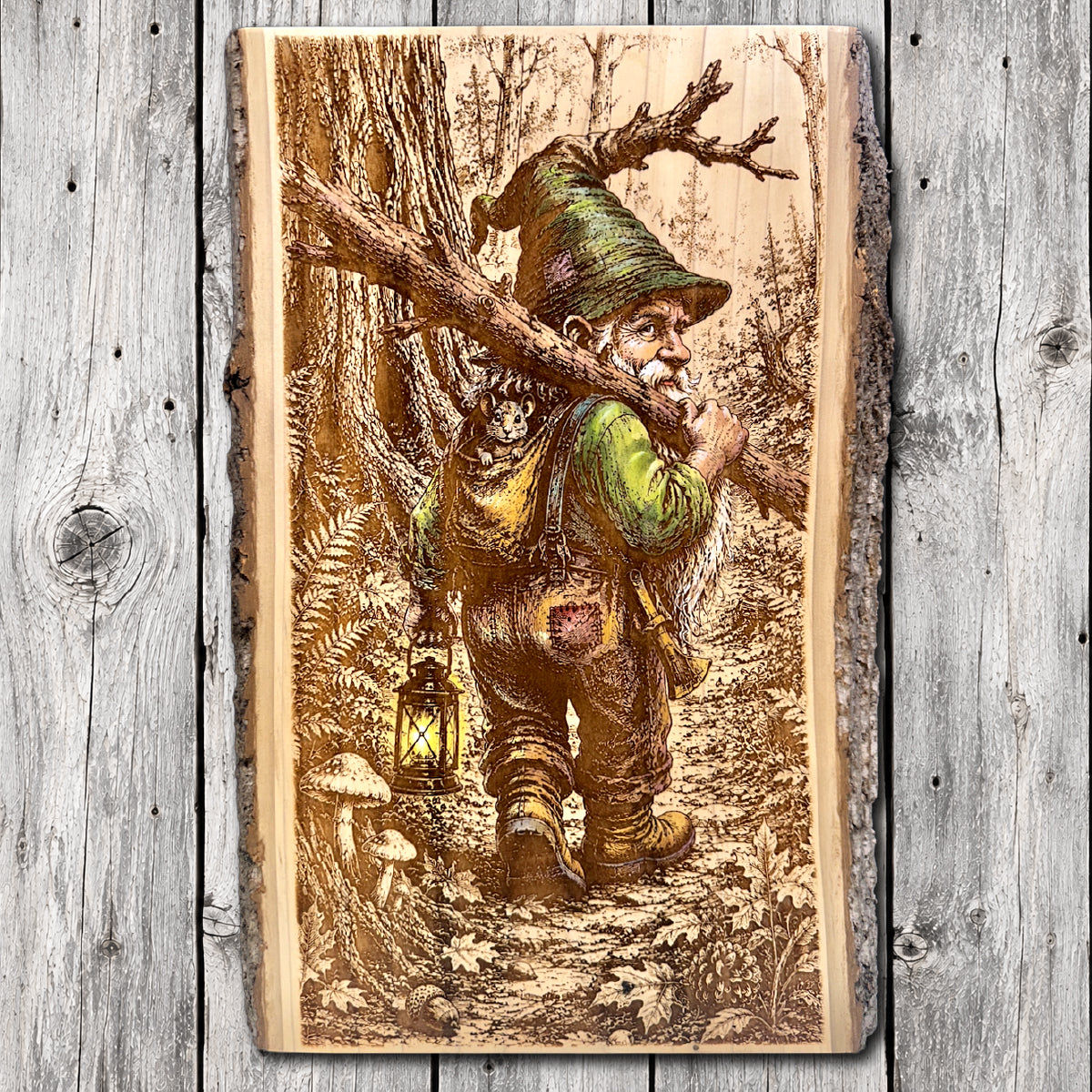 Hand-painted and laser engraved live edge wood wall art featuring a woodland gnome carrying a tree branch and glowing lantern, with a small mouse peeking from his backpack along a forest trail.